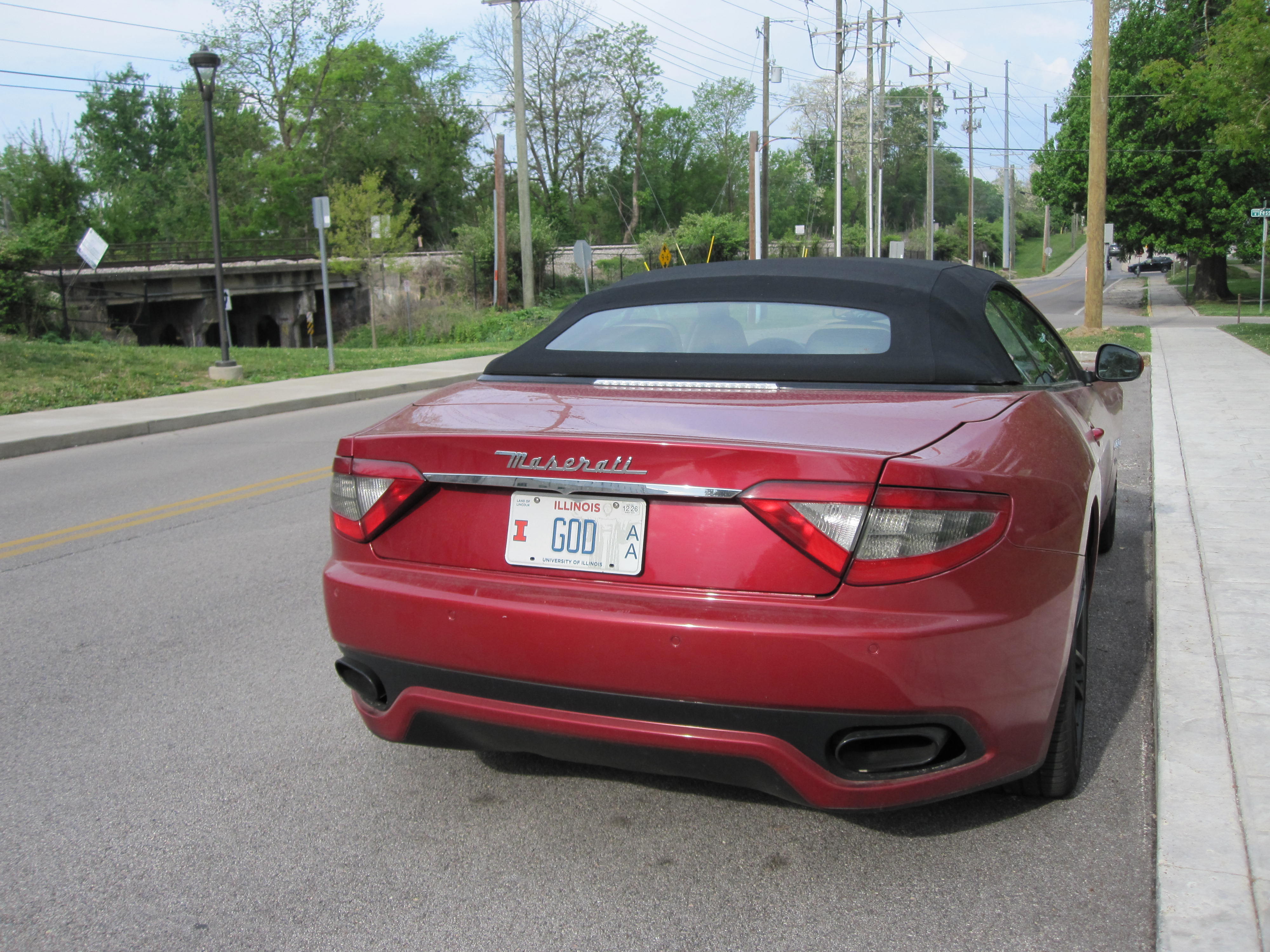 a Maserati with a license plate that says GOD