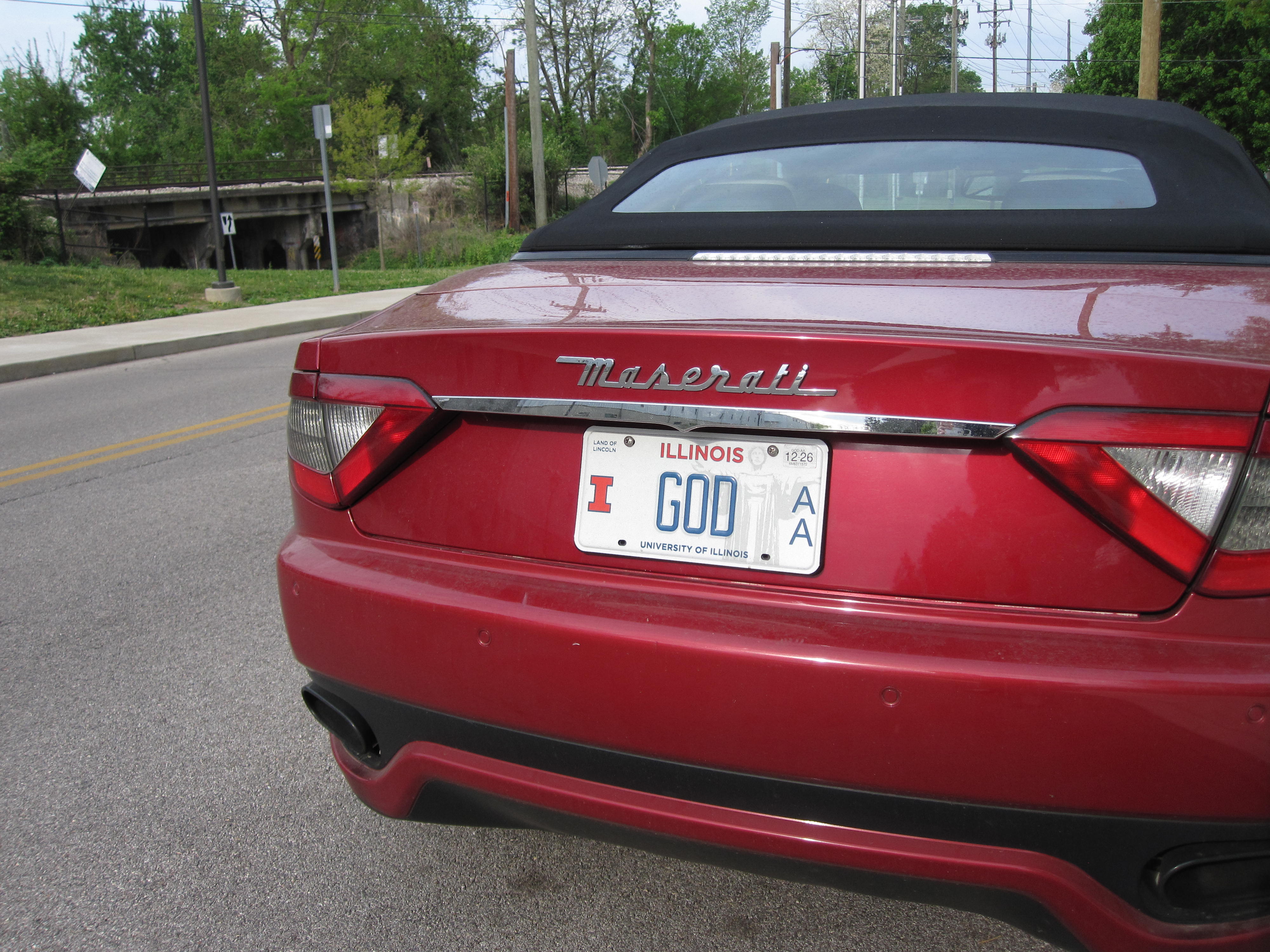 a Maserati with a license plate that says GOD