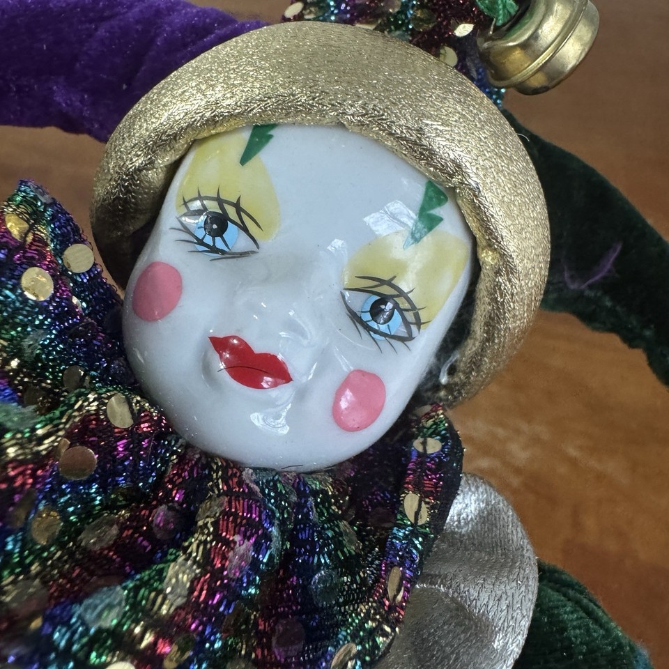 an extreme closeup of a porcelain faced clown