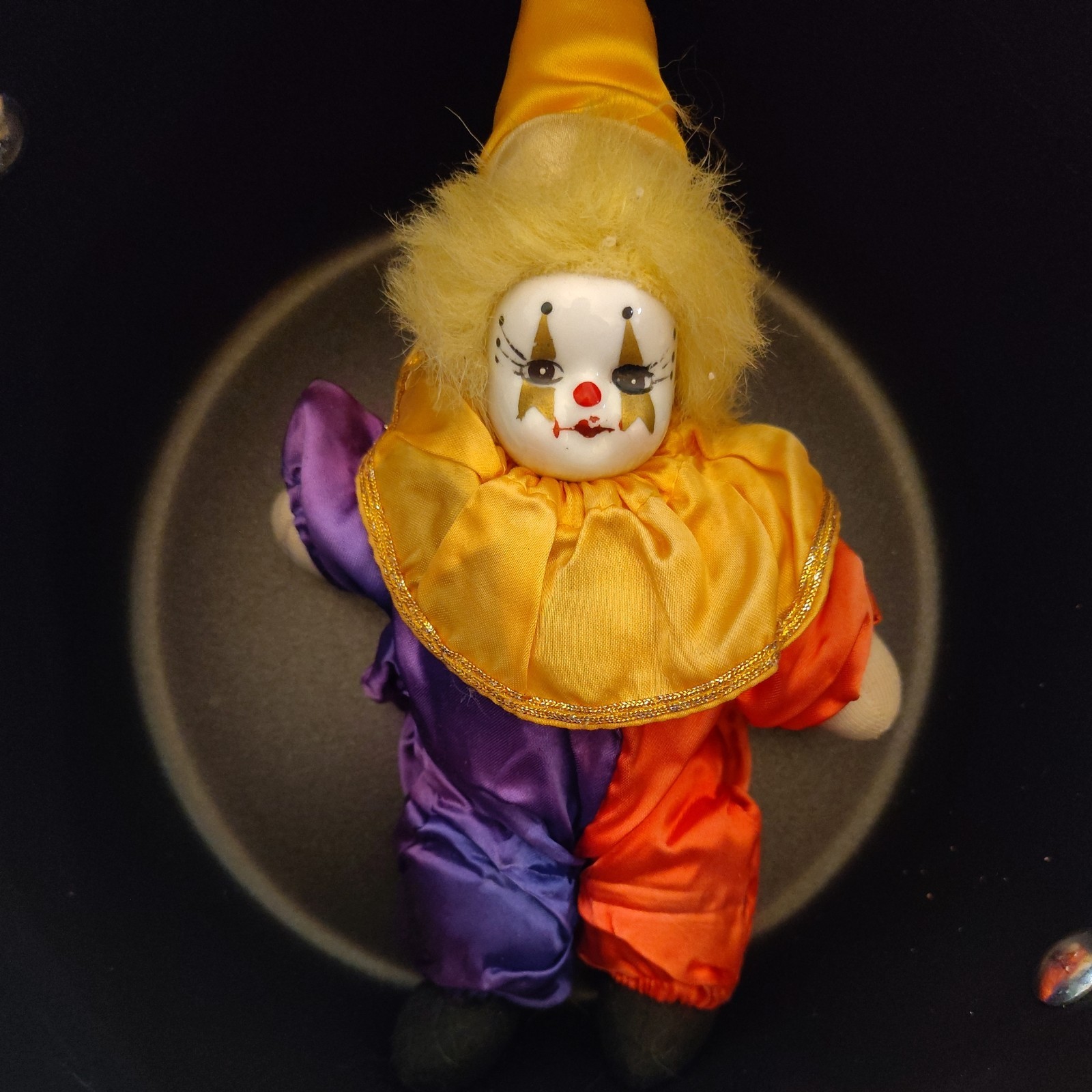 a clown in focus in a way that makes it look like it's her moment