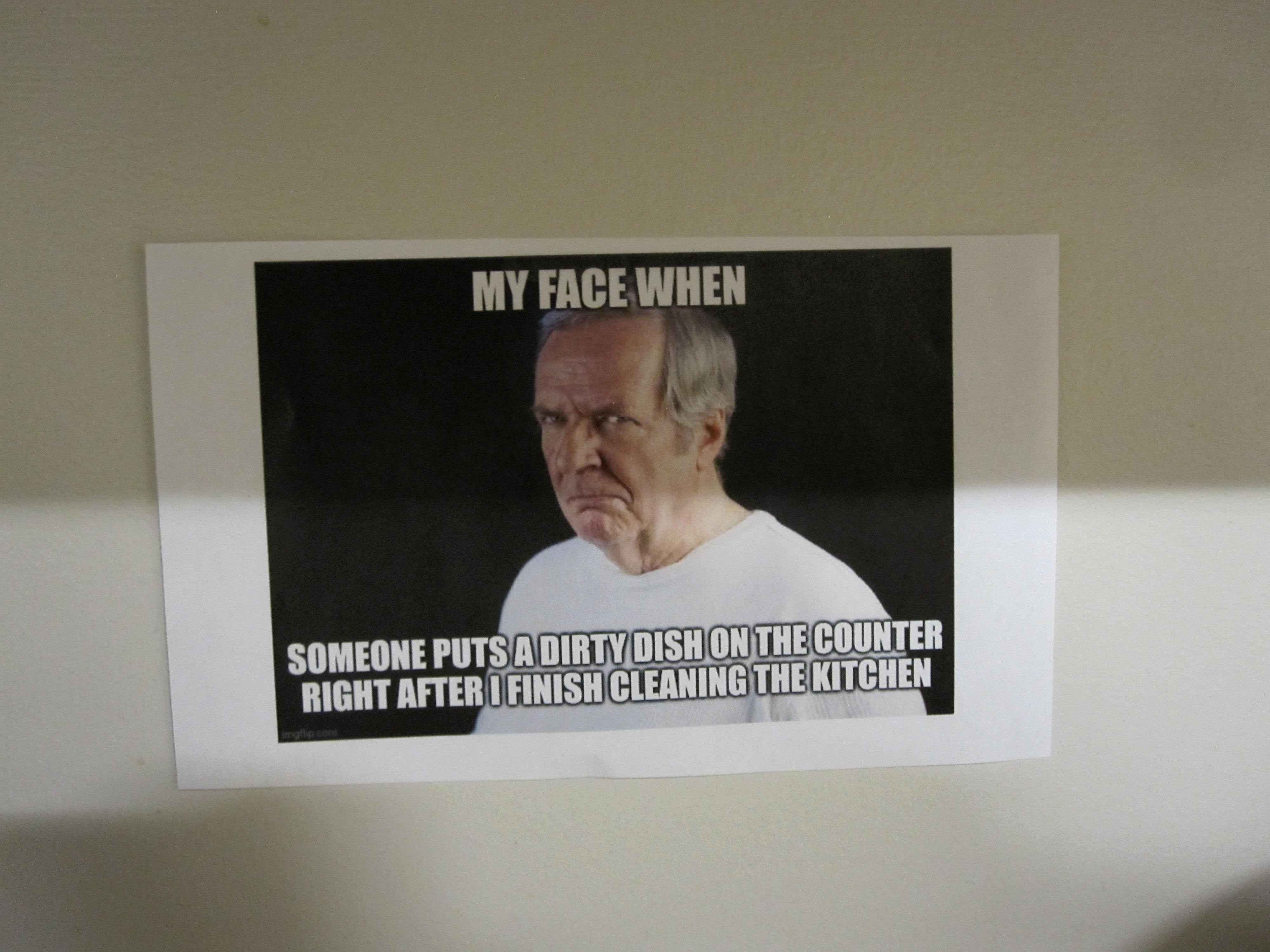 a my face when meme that has been printed out and taped to a wall