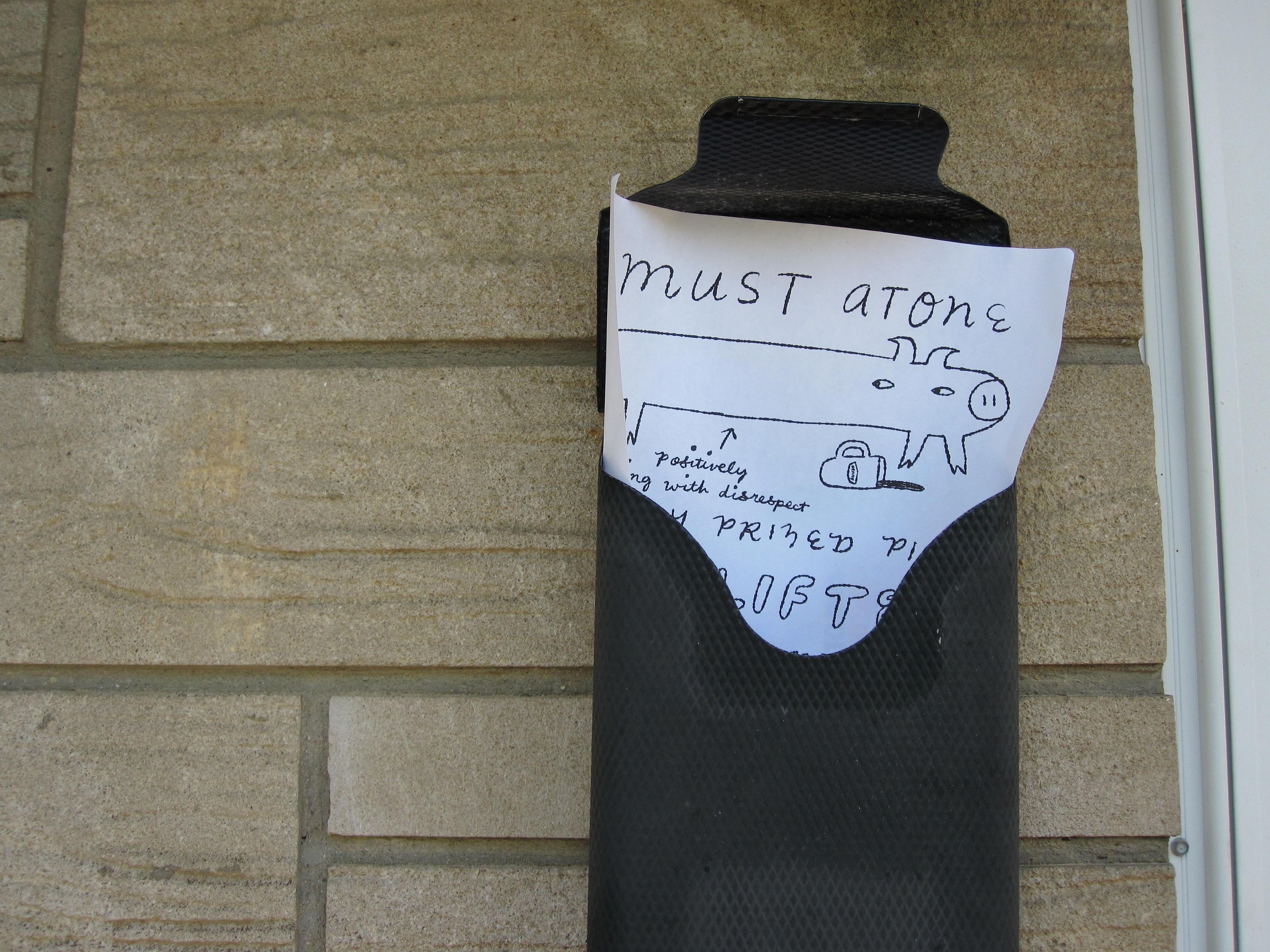 a flier about a missing pig is tacked up