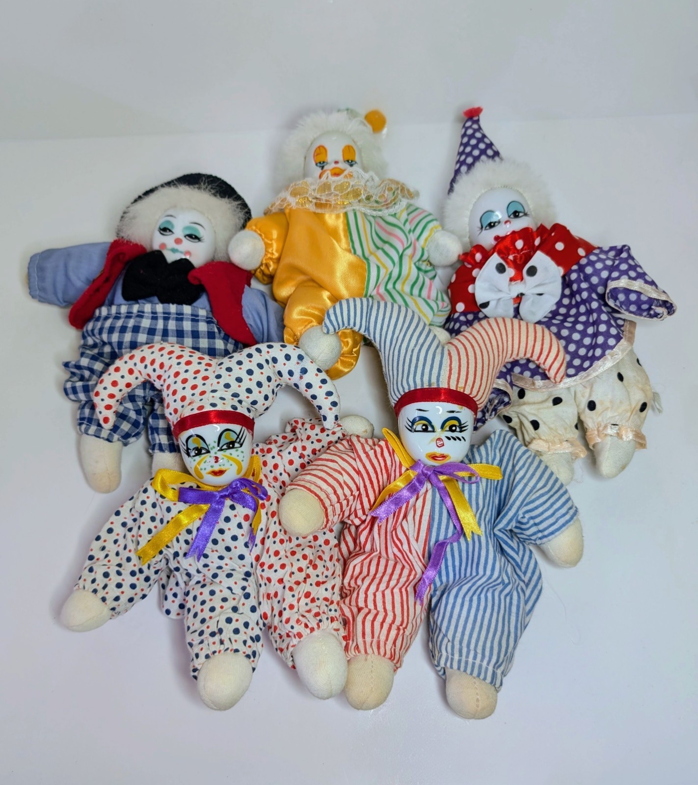a group of five softbody clowns form a star shape