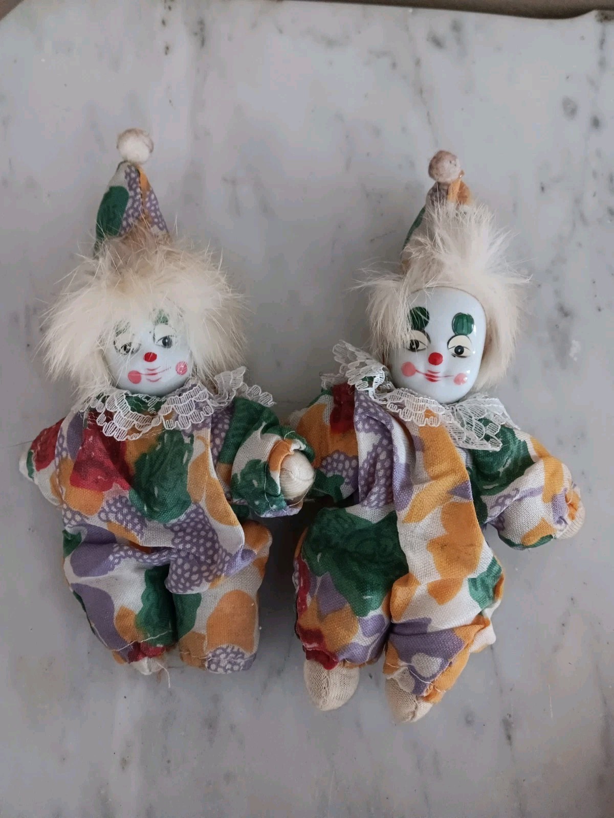 two very similar porcelain faced softbody clowns